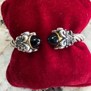 Sterling silver cuff bracelet with 14 karat gold and onyx highlights.